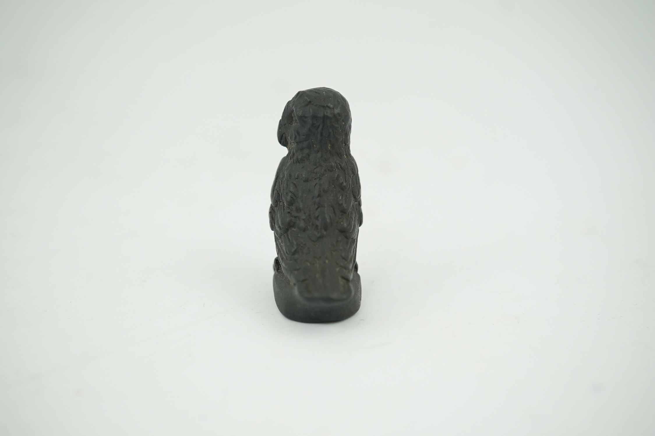 Attributed to Wedgwood, a black basalt intaglio fob seal, c.1809, modelled as an owl, inscribed ‘For further Particulars Enquire Within, 3.5cm high. Condition - good